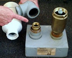 Tank-mount 'tee' removes easily to get to the interior check valve.